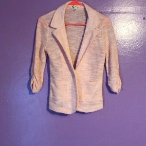 Light pink knit blazer.